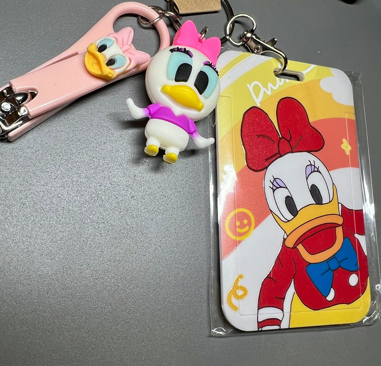 41. Baby Duck Badge Reel, Daisy Duck Nail Clippers and Badge Holder