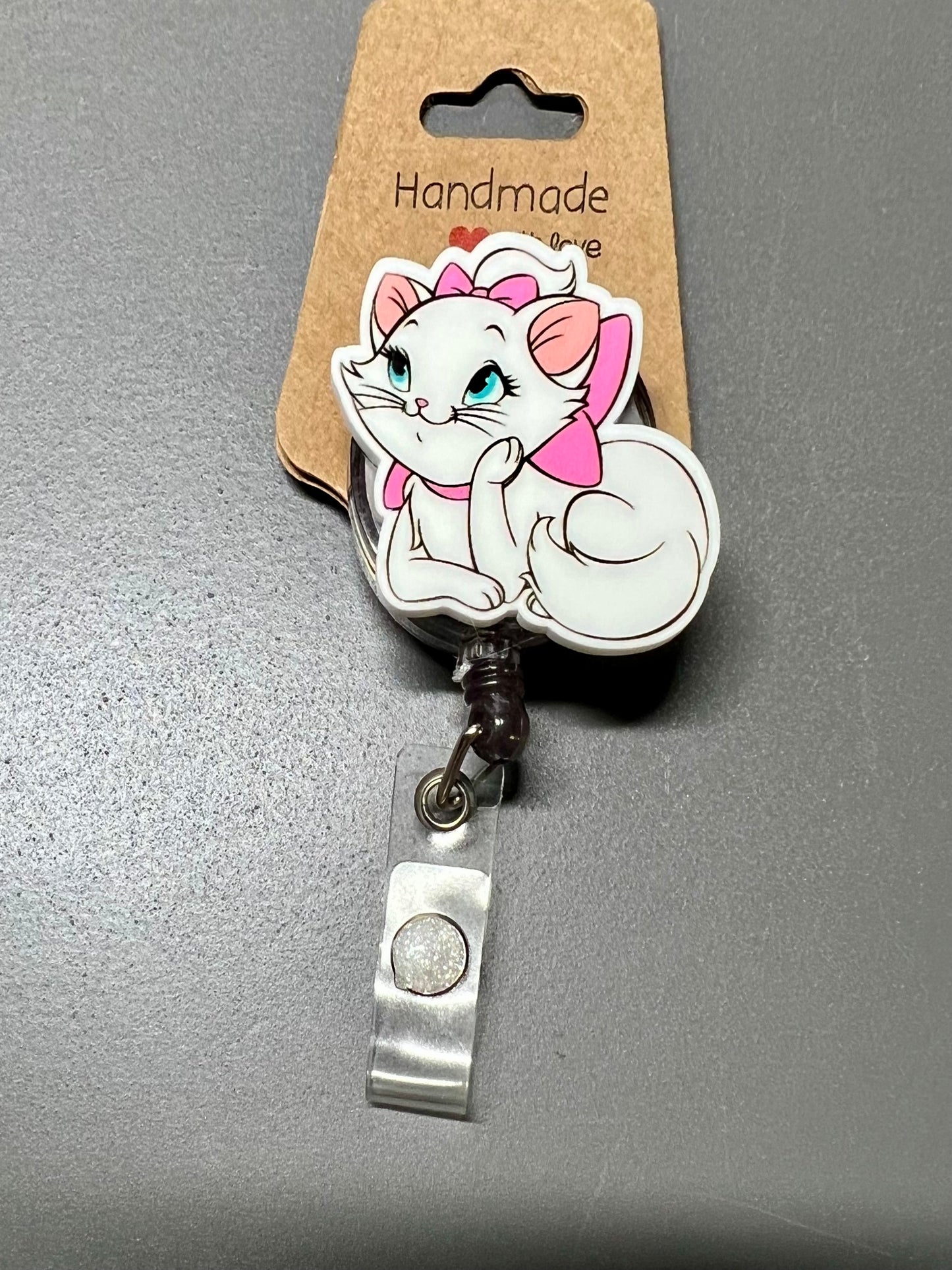 133. Cat Badge Reel